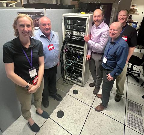 A group shot of Canadian SKA Science Director Prof. Kristine Spekkens, SKAO Director-General Prof. Phil Diamond and SKA-Mid Senior Project Manager Ben Lewis visiting the MDA Space early correlator integration lab hosted by Mike Pleasance NRC Project Lead, and MDA Space SKA Program Manager David Stevens.