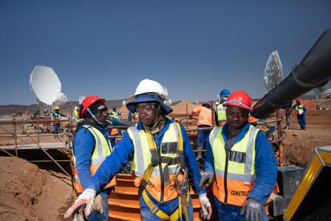 Workers at the SKA-Mid site in hi-vis outfits.